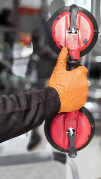auto glass technician at work